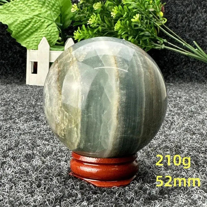Stunning Blue Calcite Crystal Sphere, 52mm, 210g, showcasing serene blue tones for peace and emotional healing.