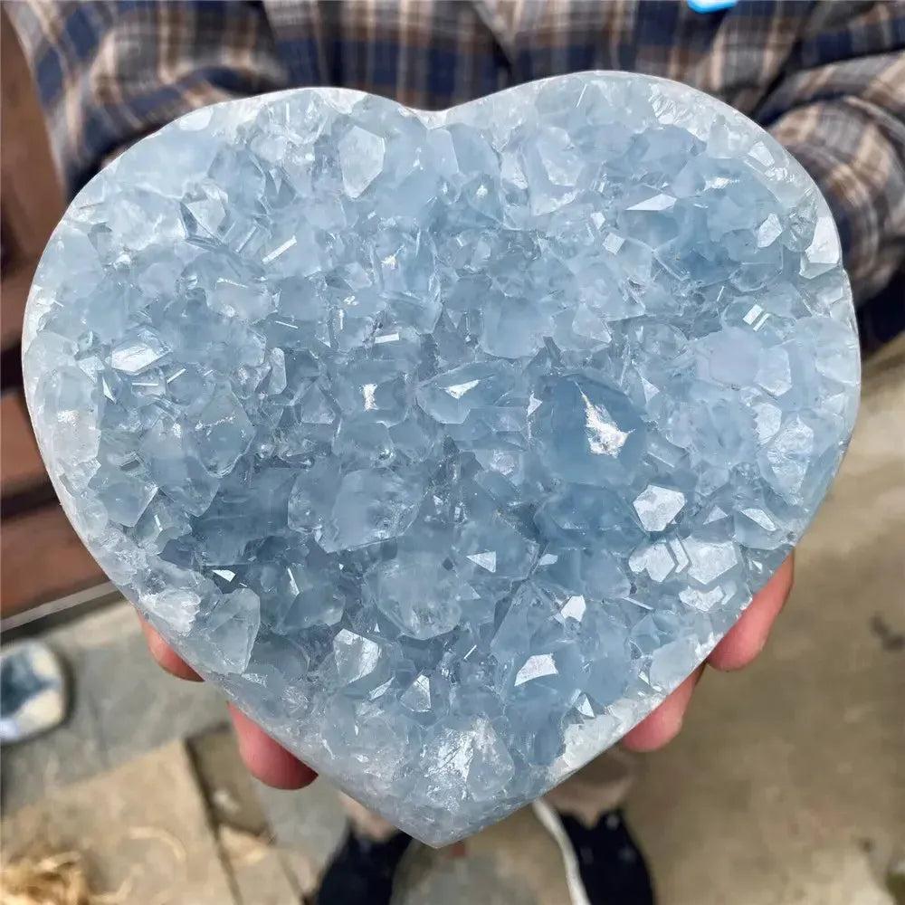 Blue Celestite Crystal Heart: Exquisite sky-blue crystalline heart, carved from natural raw stone, promoting peace and love.
