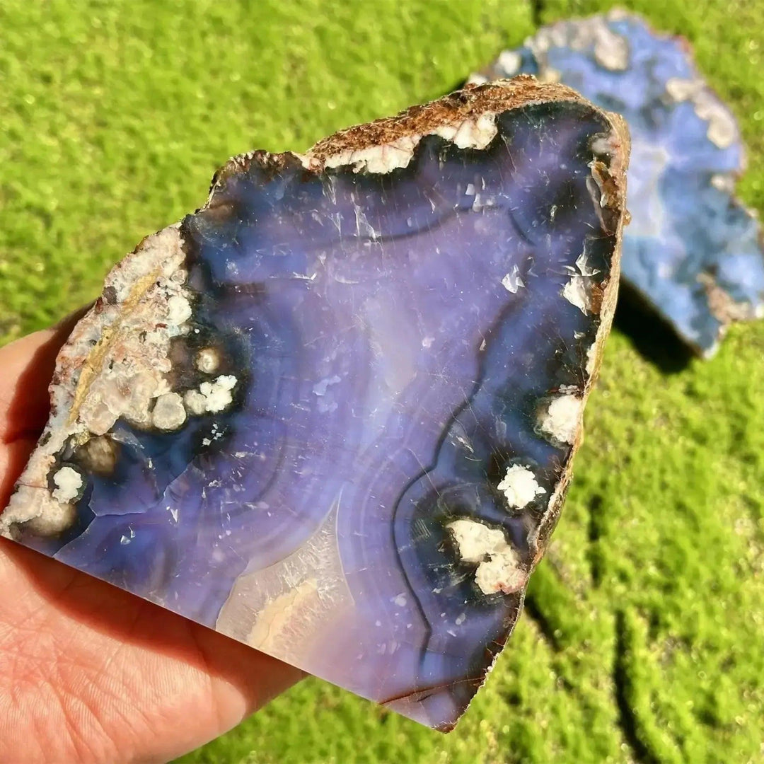 Blue Flower Agate Crystal Slab with deep ocean blues, creamy beige cherry blossom patterns, and a raw edge.
