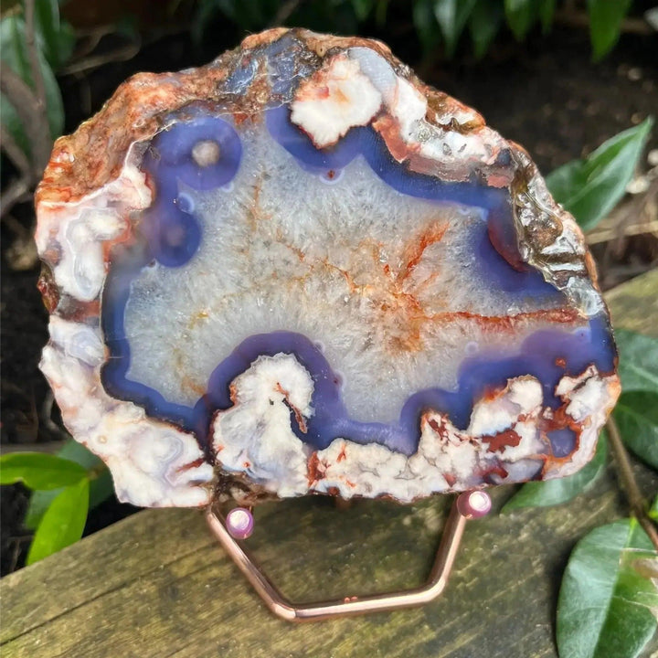 Blue Flower Agate Crystal Slab with deep ocean blues, creamy beige cherry blossom patterns, and natural edge.
