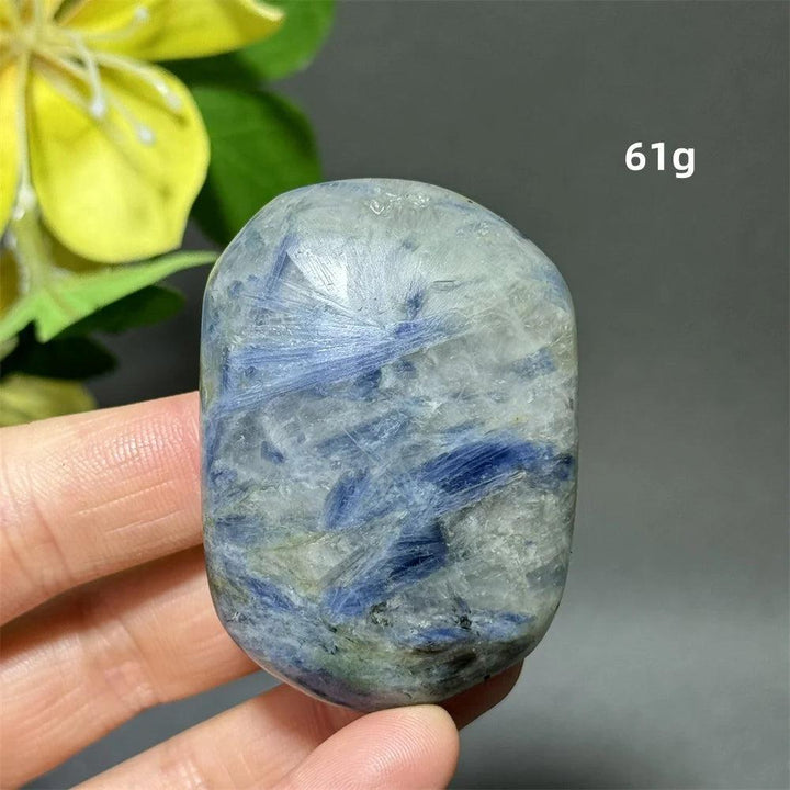 Polished 61g blue kyanite palm stone with deep striated blue ribbons for grounding, peace, and throat chakra healing.