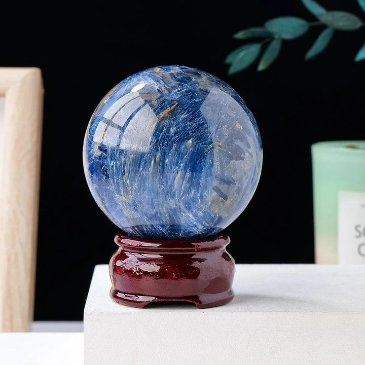 Polished Blue Kyanite crystal sphere with striking striated blue patterns for energetic alignment and healing.