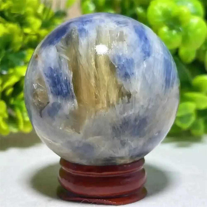 Polished Blue Kyanite crystal sphere with blue and white mineral patterns, perfect for Throat Chakra reflection.