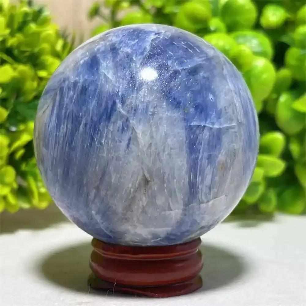 Polished Blue Kyanite crystal sphere with deep blue and white mineral patterns, perfect for Throat Chakra reflection.