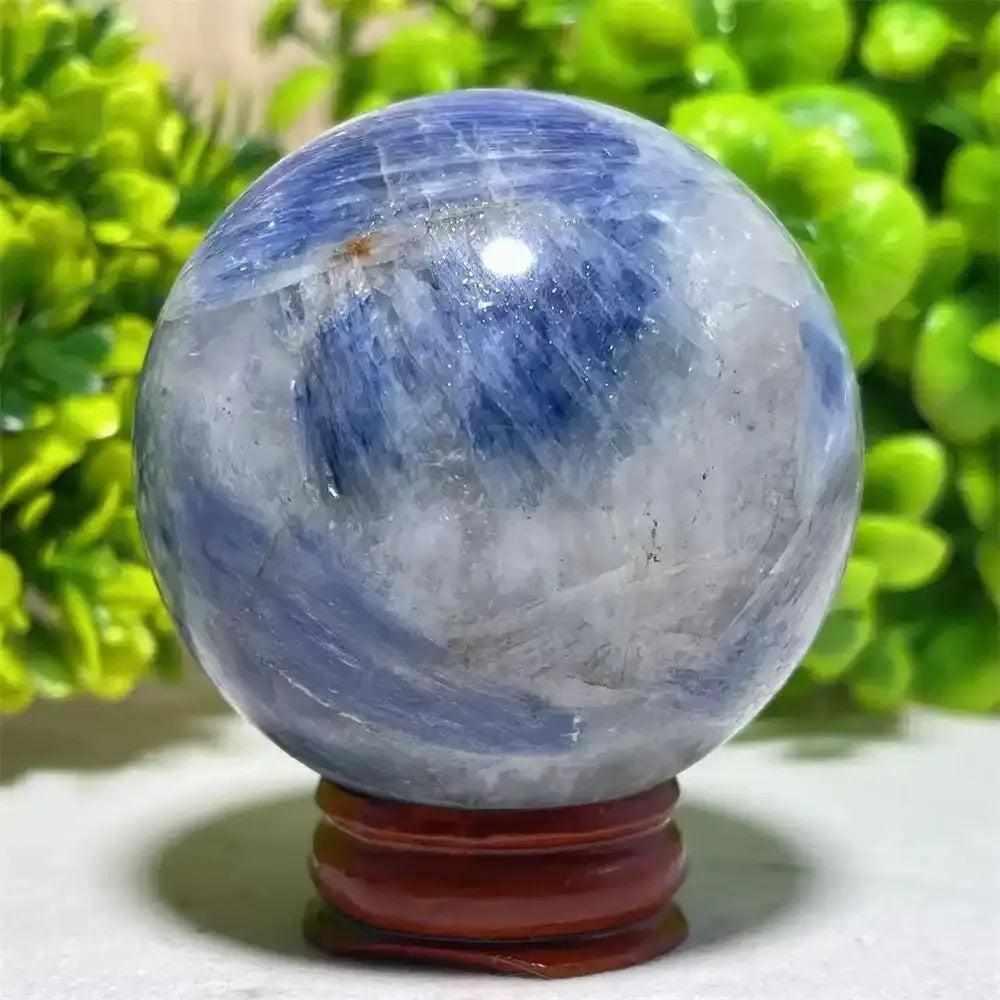 Polished Blue Kyanite crystal sphere with deep blue streaks, perfect for Throat Chakra reflection and mindful decor.