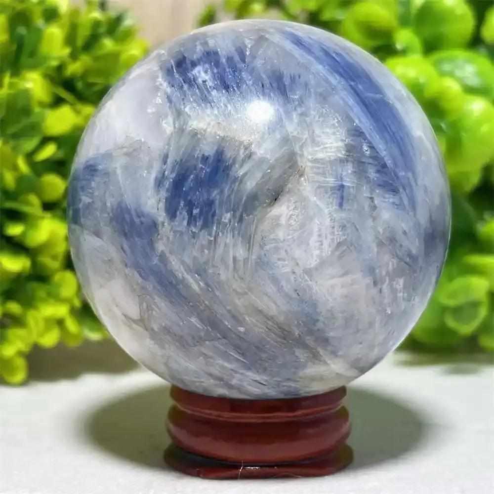 Polished Blue Kyanite crystal sphere with deep blue and white streaks, perfect for Throat Chakra mindful reflection.