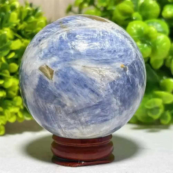 Polished Blue Kyanite crystal sphere with blue and white marbling, perfect for Throat Chakra reflection and mindfulness.