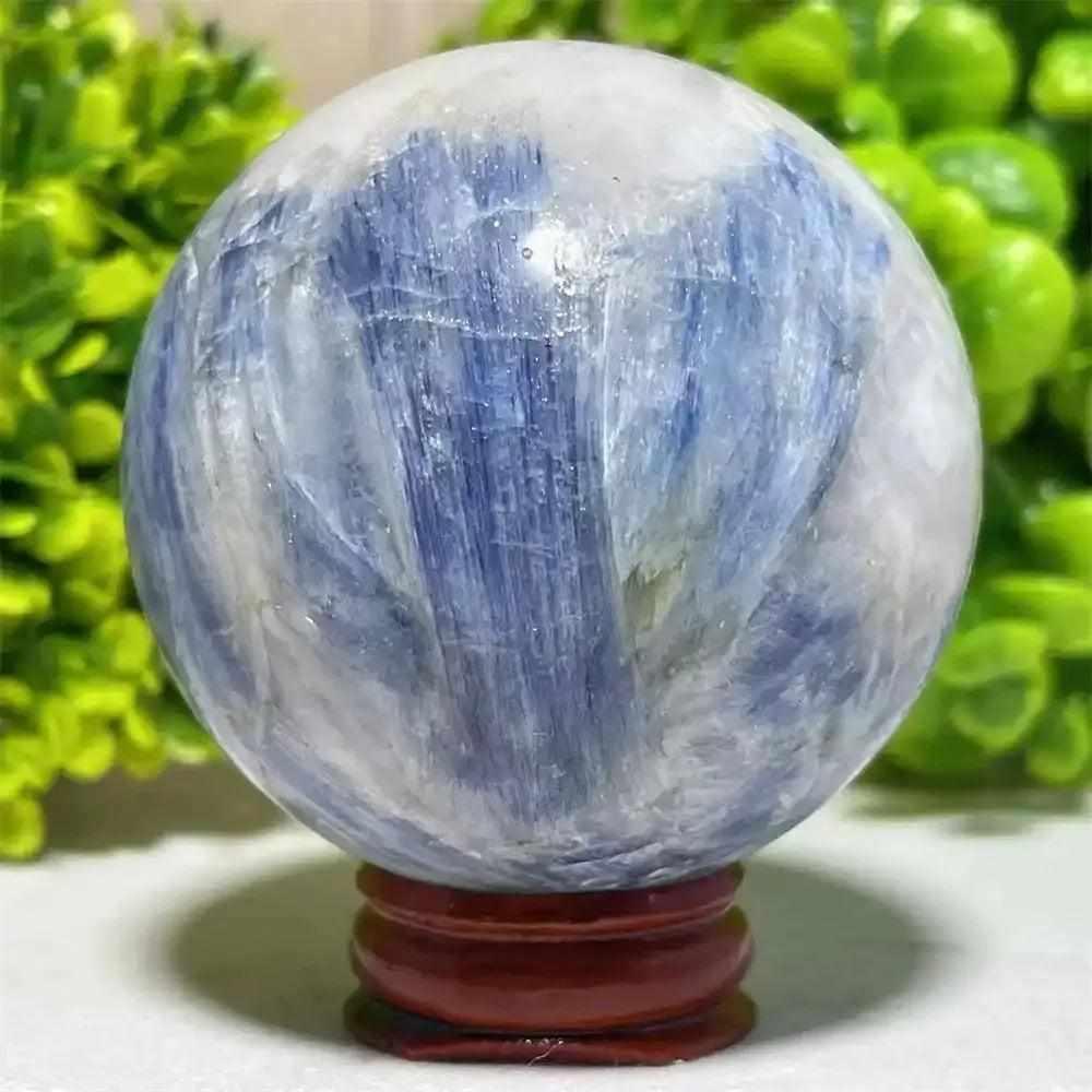 Polished Blue Kyanite crystal sphere with striking blue and white patterns, perfect for Throat Chakra reflection.