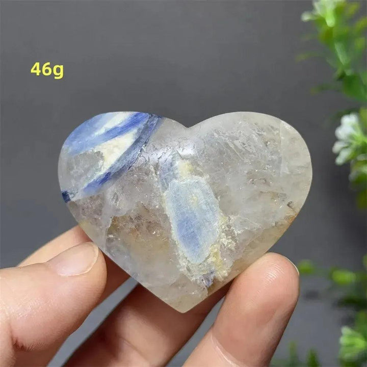 Captivating Blue Apatite Crystal Heart, 46g, with vibrant electric blue hues and natural inclusions, held in hand.
