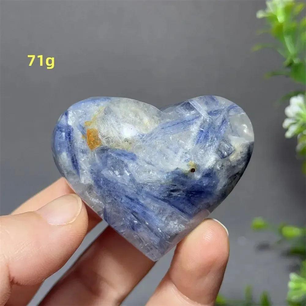 Blue Apatite Crystal Heart: Vibrant electric blue, smooth polished heart-shaped crystal, 71g, held in hand.