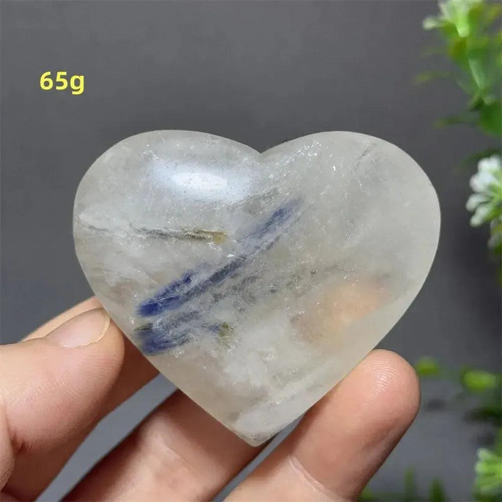 Polished clear quartz heart with vibrant blue apatite inclusions, weighing 65g, for love, communication, and manifestation.
