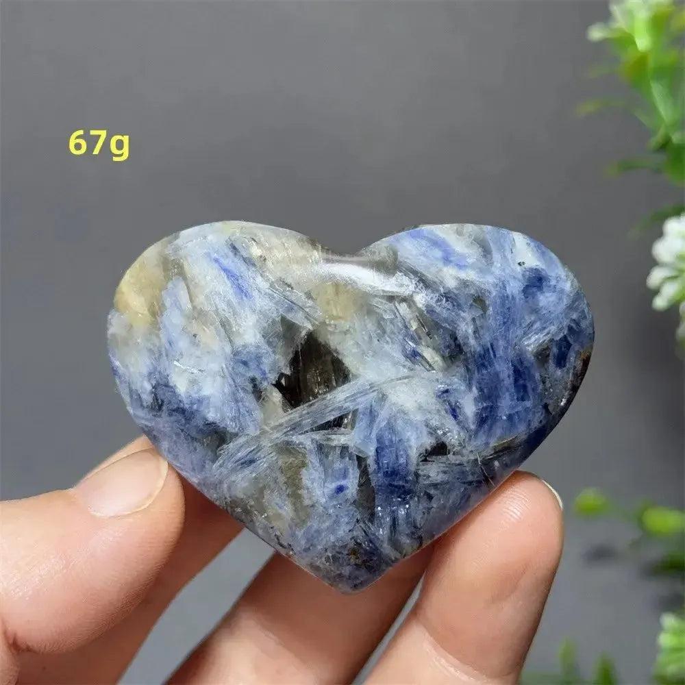 Polished Blue Apatite Crystal Heart, 67g, with vibrant electric blue hues and natural inclusions, held in hand.