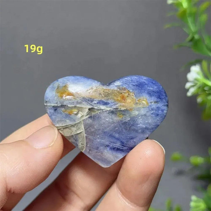 Captivating Blue Apatite Crystal Heart, 19g, with vibrant electric blue hues and natural inclusions, held in hand.