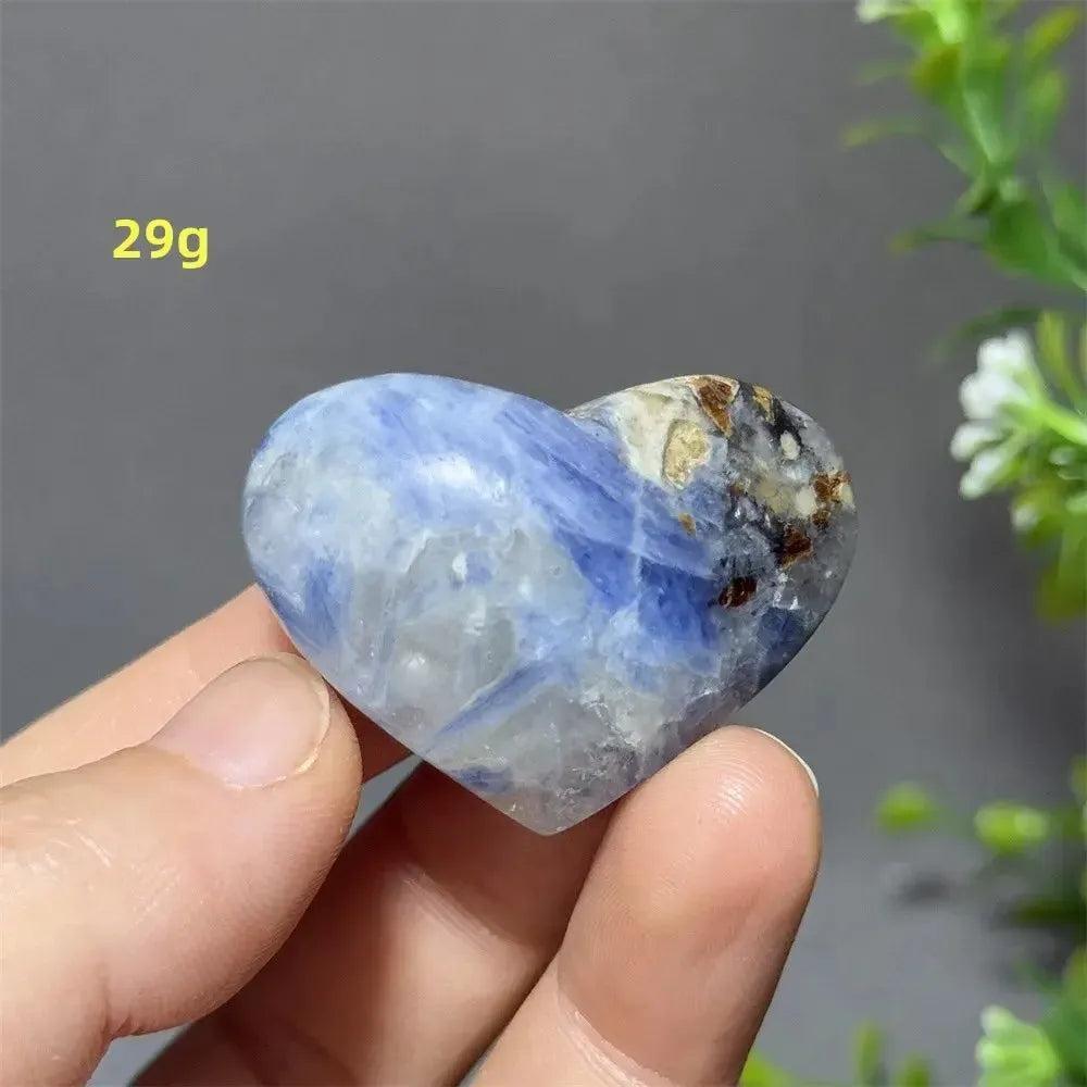 Captivating Blue Apatite Crystal Heart, 29g, with vibrant electric blue hues and natural inclusions, held in hand.