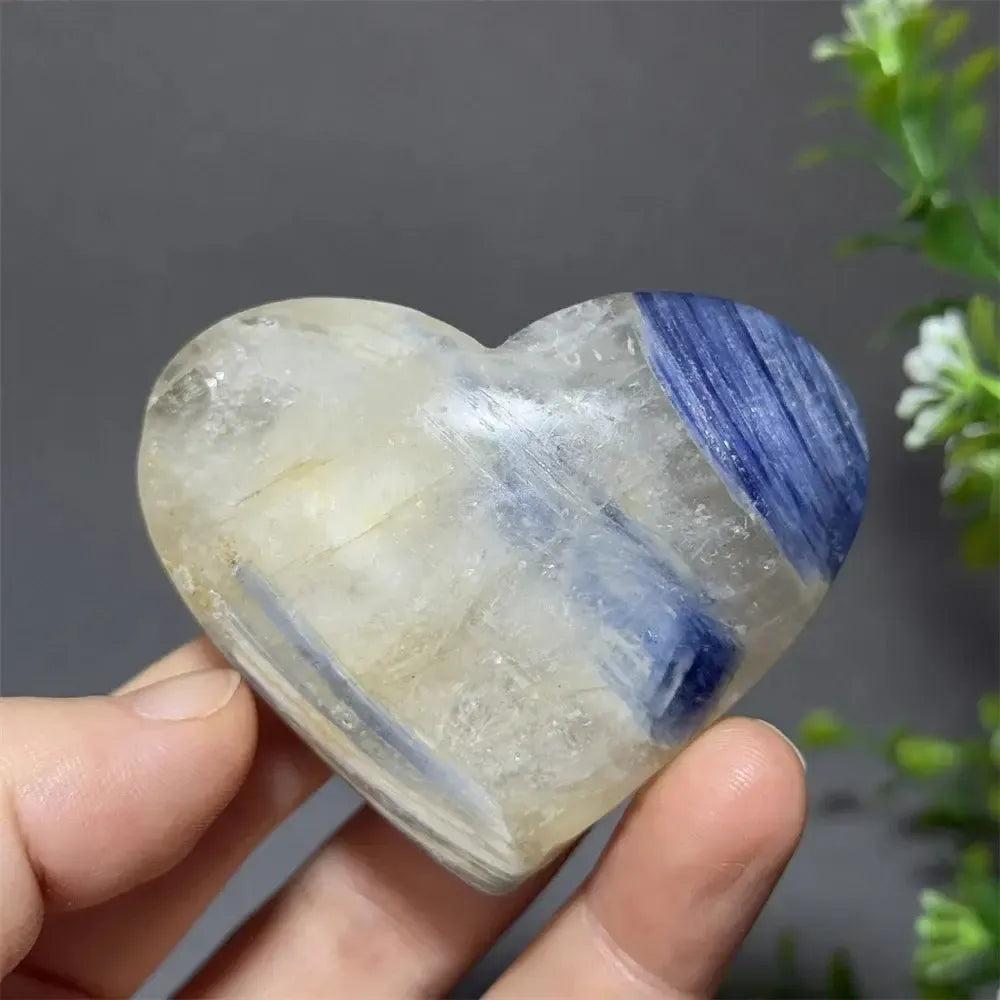 Captivating Blue Apatite Crystal Heart, a smooth, polished stone with vibrant electric blue hues and natural inclusions.