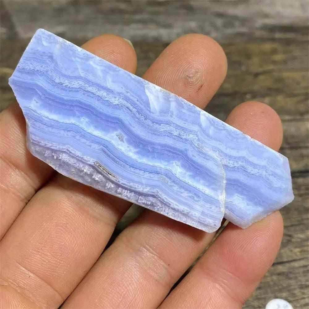 Polished Blue Lace Agate slab featuring calming pale blue and white lace-like bands for Throat Chakra healing and display.