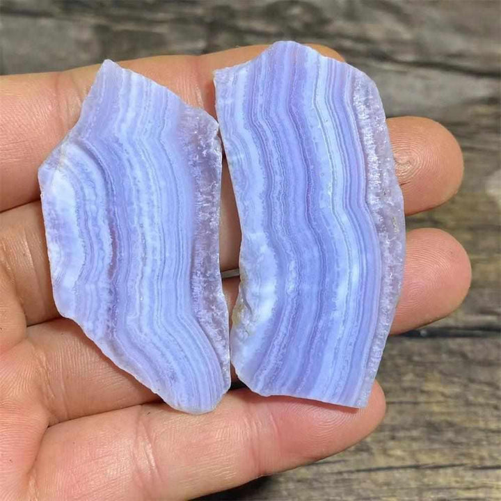 Two polished Blue Lace Agate slabs featuring delicate pale blue and white lace-like bands for calming Throat Chakra energy.