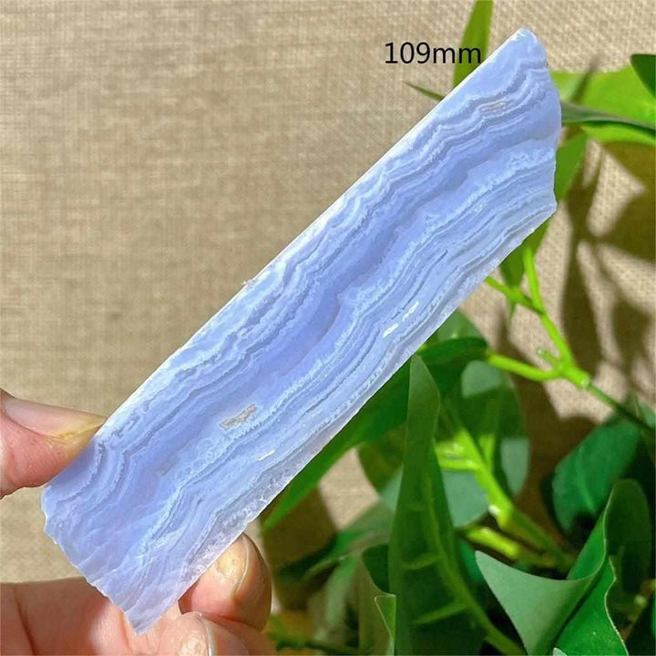 Polished Blue Lace Agate slab featuring calming pale blue and white lace-like bands for Throat Chakra healing and display.