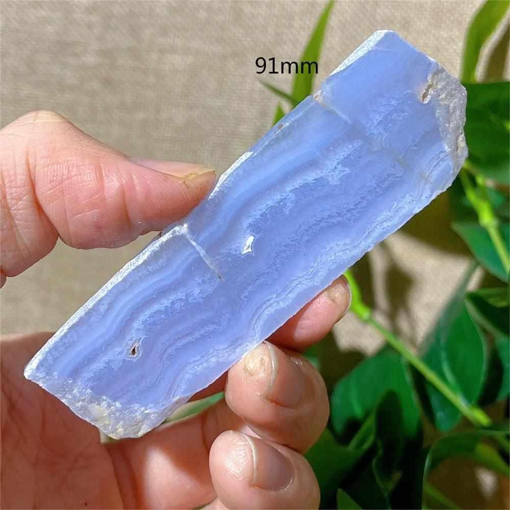 Polished Blue Lace Agate slab featuring delicate pale blue and white bands for calming Throat Chakra energy.