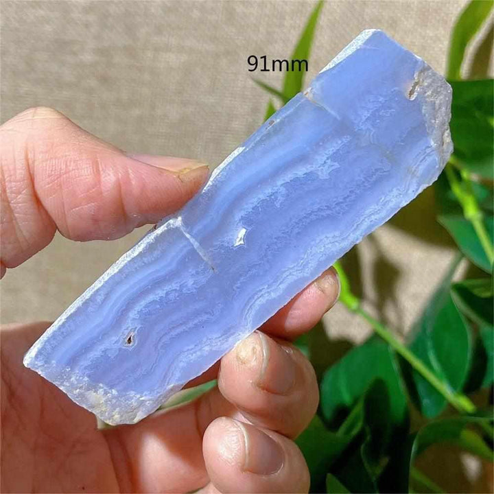 Polished Blue Lace Agate slab featuring delicate pale blue and white bands for calming Throat Chakra energy.