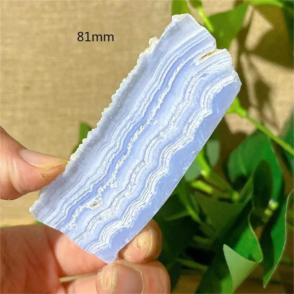 Polished Blue Lace Agate slab featuring calming pale blue and white lace-like bands for soothing Throat Chakra energy.