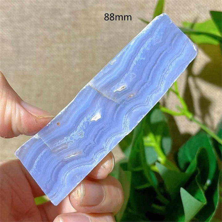 Polished Blue Lace Agate slab featuring delicate pale blue and white bands for calming Throat Chakra energy.