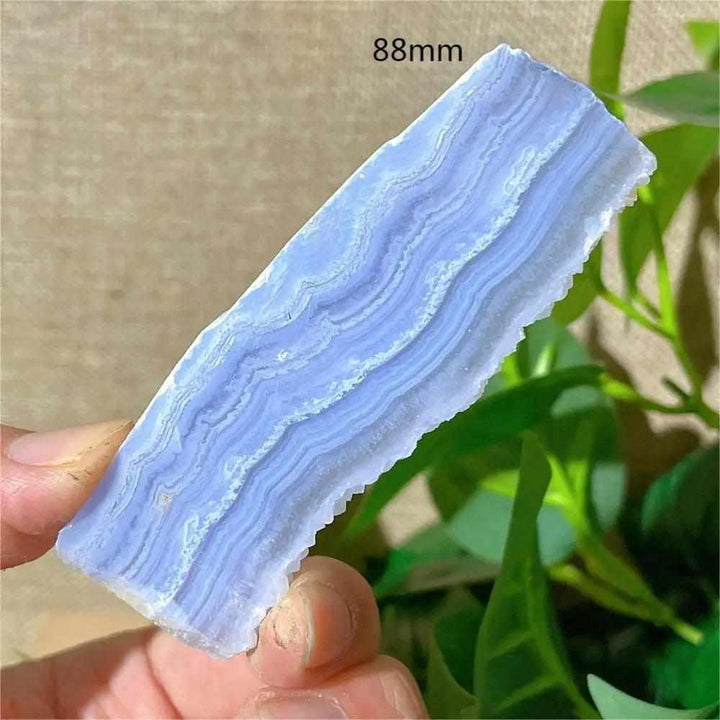 Polished Blue Lace Agate slab with delicate pale blue and white bands, perfect for calming Throat Chakra energy.