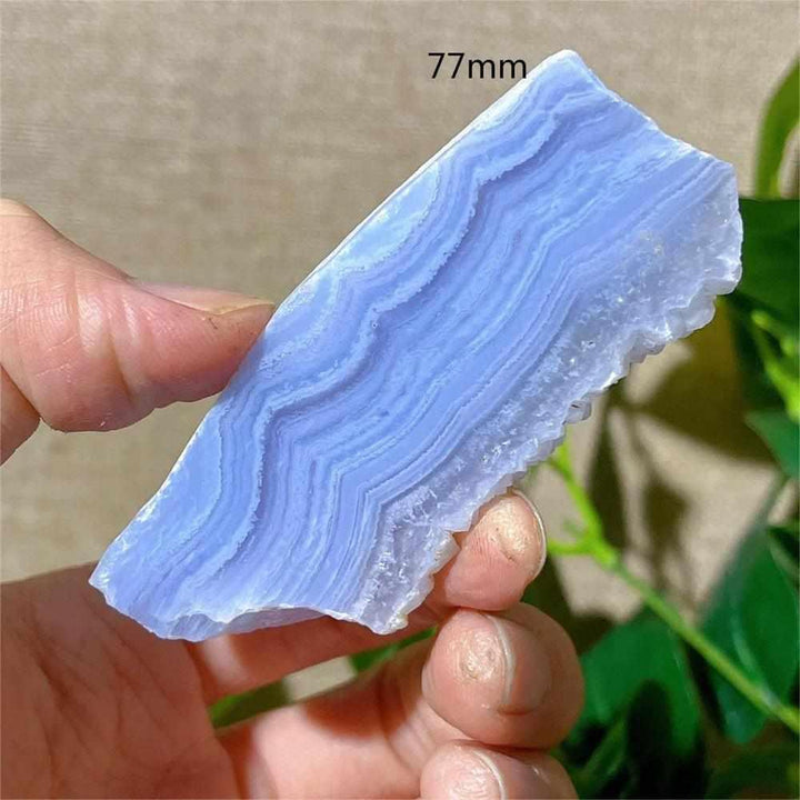 Polished Blue Lace Agate slab featuring delicate pale blue and white bands for calming Throat Chakra energy.