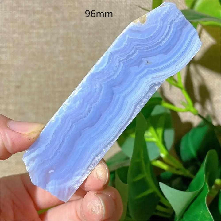 Polished Blue Lace Agate slab featuring delicate pale blue and white bands for calming Throat Chakra energy.