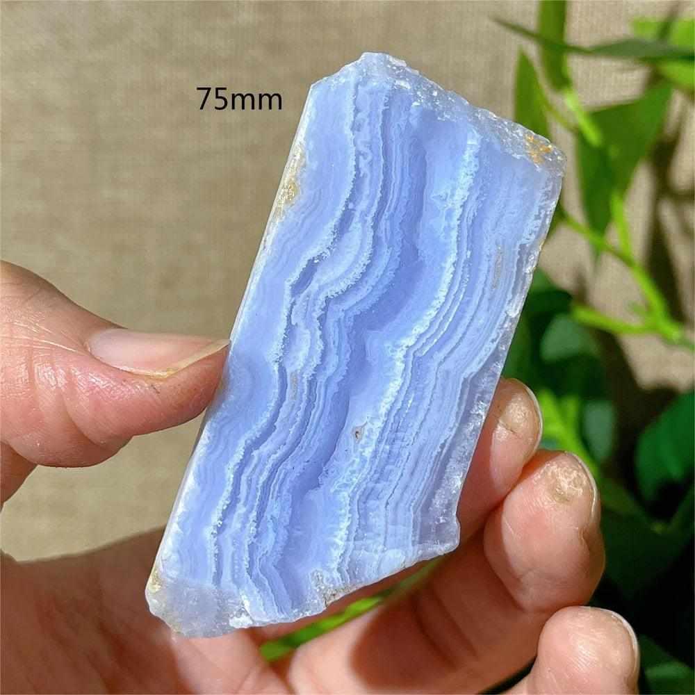 Polished Blue Lace Agate slab with delicate pale blue and white bands, perfect for Throat Chakra calm and desk display.