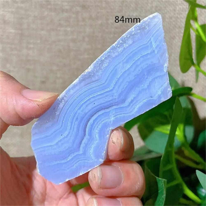 Polished Blue Lace Agate slab with calming pale blue and white lace-like bands, perfect for Throat Chakra healing.