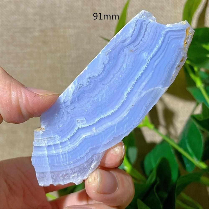 Polished Blue Lace Agate slab featuring calming pale blue and white lace-like bands, perfect for Throat Chakra healing.