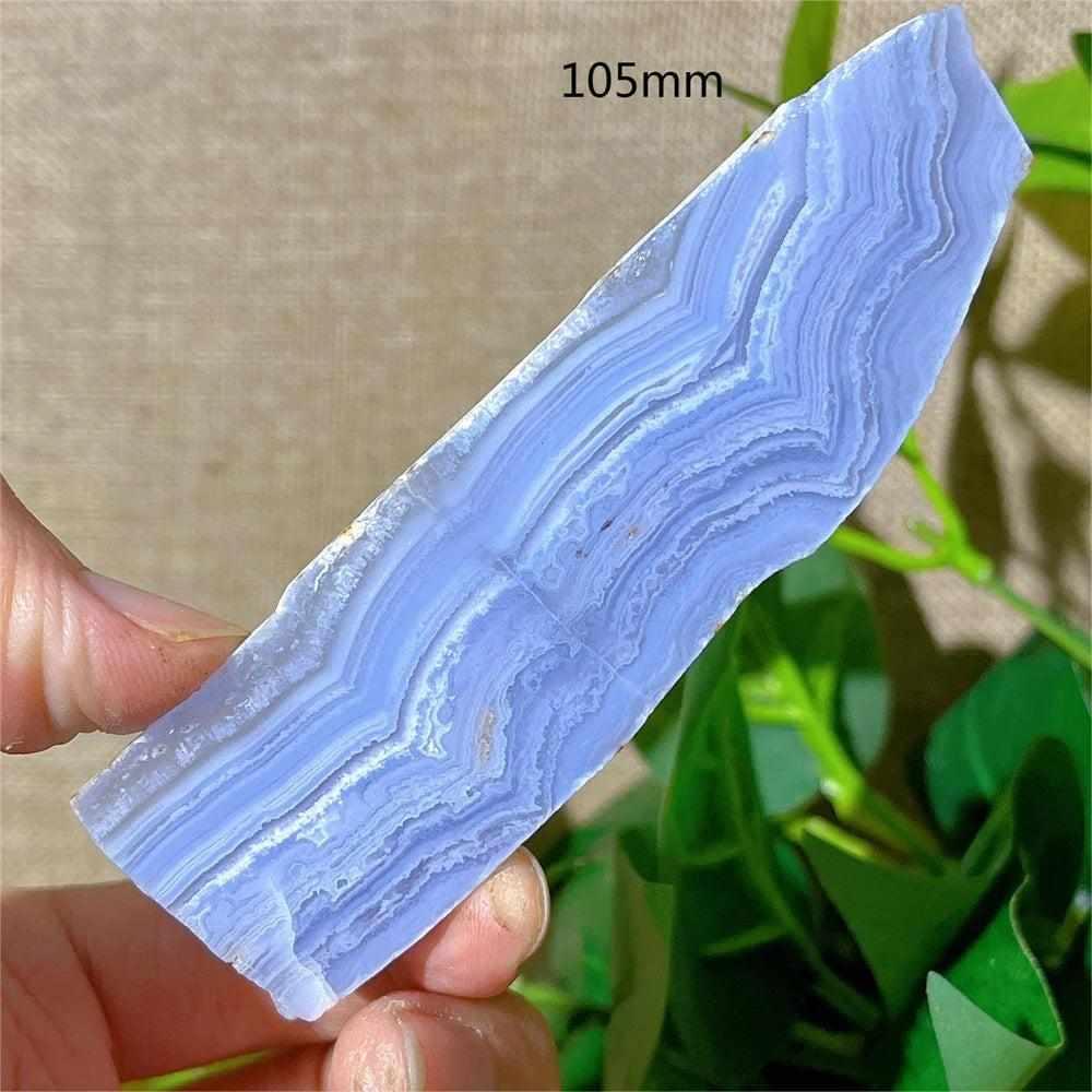 Polished Blue Lace Agate slab featuring calming pale blue and white lace-like bands for Throat Chakra healing.