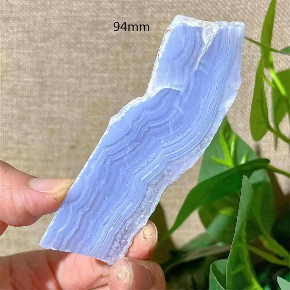 Polished Blue Lace Agate slab with delicate pale blue and white bands, perfect for calming Throat Chakra energy.