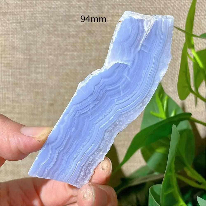 Polished Blue Lace Agate slab with delicate pale blue and white bands, perfect for calming Throat Chakra energy.