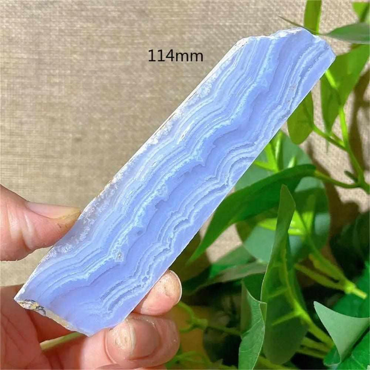 Polished Blue Lace Agate slab featuring calming pale blue and white lace-like bands for Throat Chakra healing.
