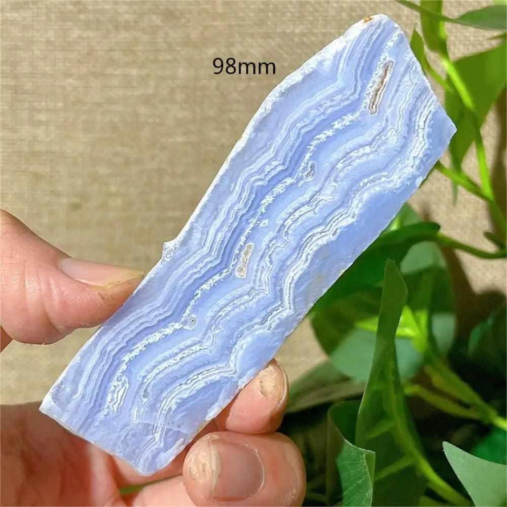 Polished Blue Lace Agate slab featuring calming pale blue and white lace-like bands, perfect for Throat Chakra healing.