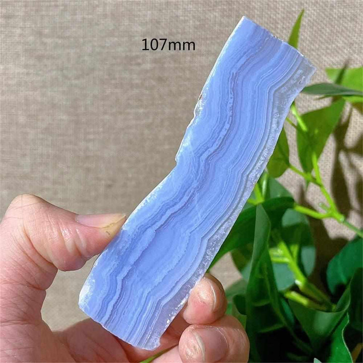 Polished Blue Lace Agate slab with delicate pale blue and white bands for calming Throat Chakra energy and desk decor.