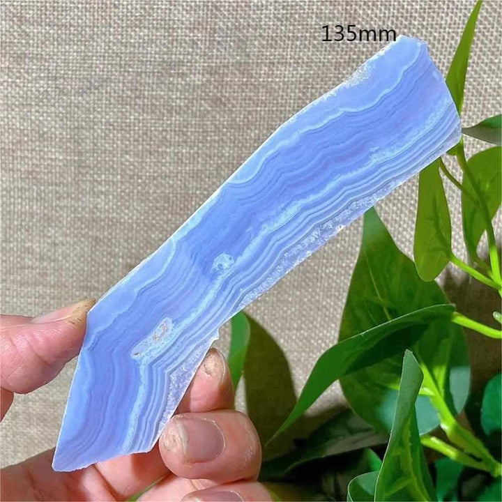 Polished Blue Lace Agate slab with delicate pale blue and white bands, perfect for Throat Chakra calm and desk display.