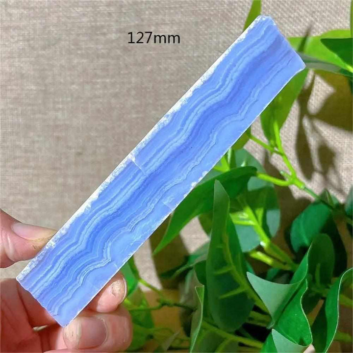 Polished Blue Lace Agate slab featuring soothing pale blue and white lace-like bands for calming Throat Chakra energy.