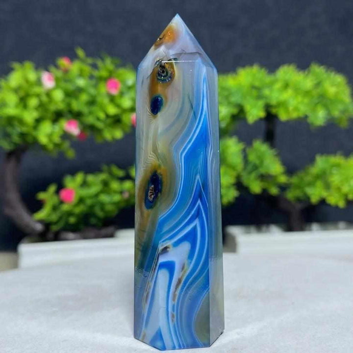 Polished Blue Lace Agate tower featuring calming sky-blue and white bands for throat chakra healing and peaceful energy.