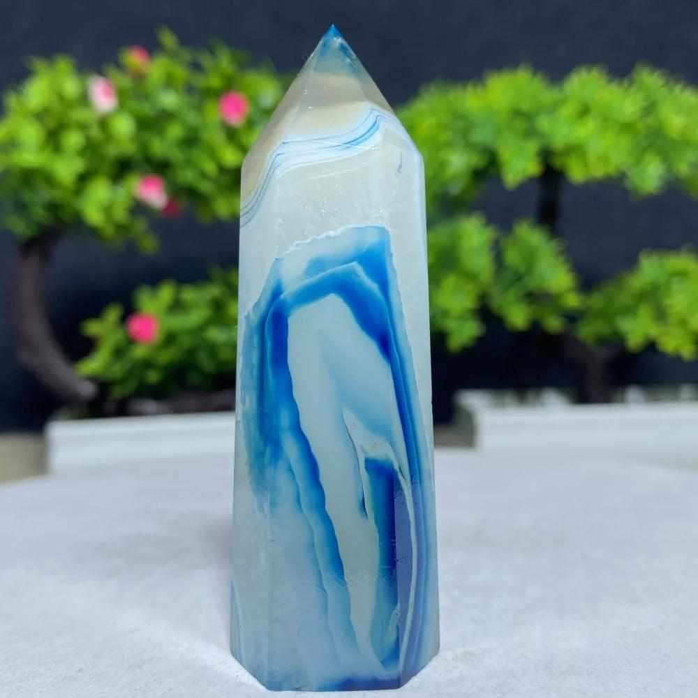 Polished Blue Lace Agate tower featuring calming sky blue and white ripples to soothe the throat chakra and bring peace.