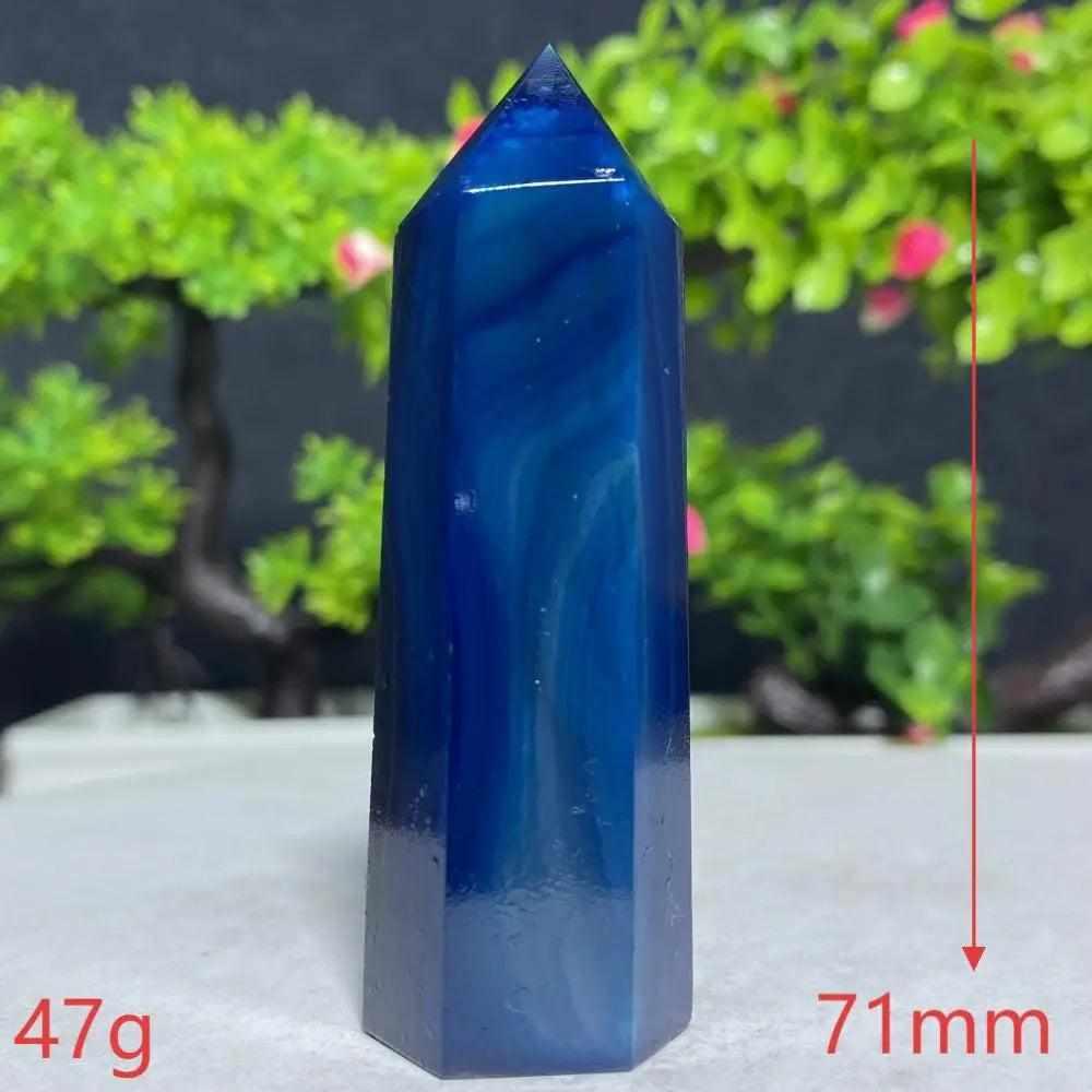 Polished Blue Lace Agate tower featuring calming deep blue bands, perfect for throat chakra healing and peaceful decor.