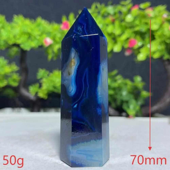 Polished Blue Lace Agate tower featuring deep blue and white calming bands, perfect for Throat Chakra healing and decor.