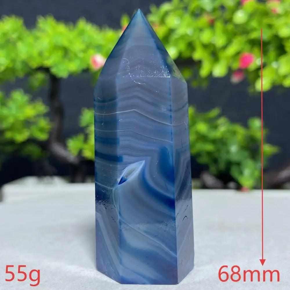 Polished Blue Lace Agate tower with calming sky-blue and white ripples, perfect for throat chakra healing and tranquility.