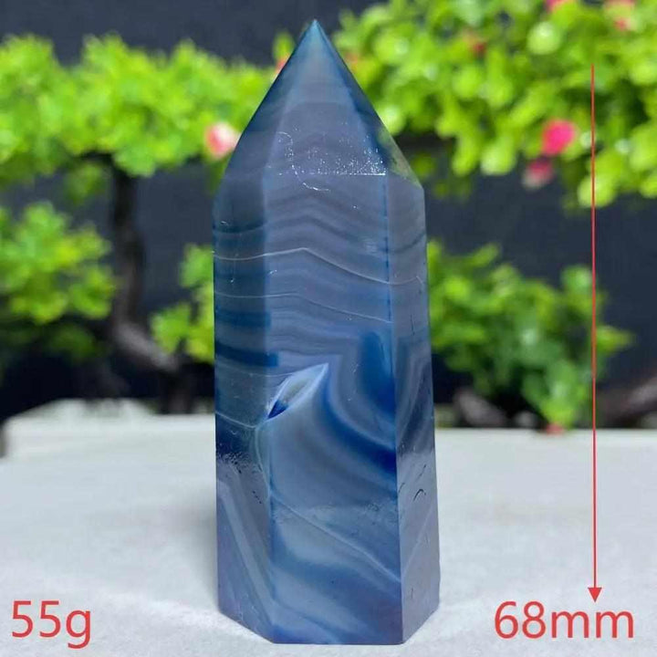 Polished Blue Lace Agate tower with calming sky-blue and white ripples, perfect for throat chakra healing and tranquility.