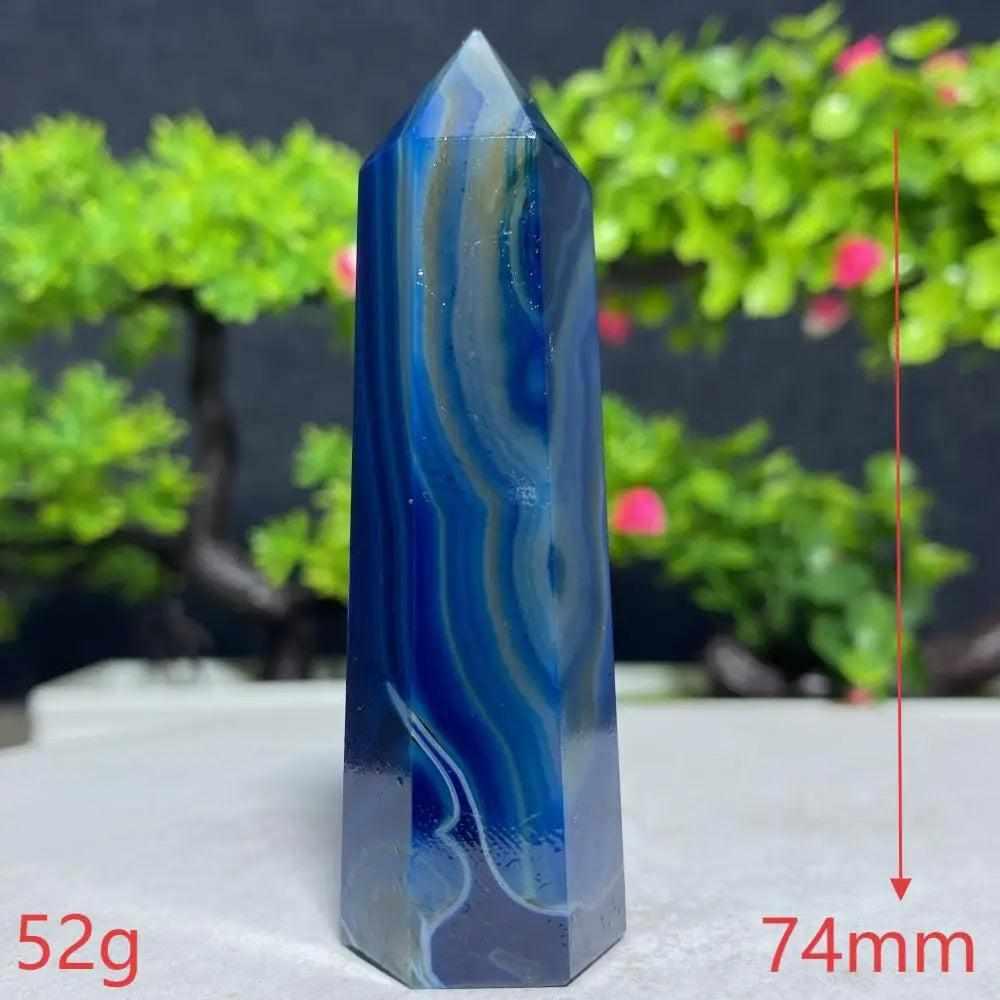Polished Blue Lace Agate tower with calming sky-blue and white ripples, perfect for throat chakra healing and tranquility.