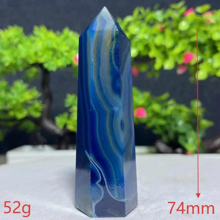 Polished Blue Lace Agate tower with calming sky-blue and white ripples, perfect for throat chakra healing and tranquility.