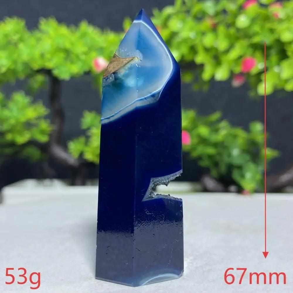 Polished Blue Lace Agate tower with deep blue banding and natural crystal vug, perfect for Throat Chakra healing.