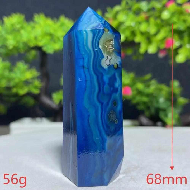 Polished Blue Lace Agate tower featuring calming sky-blue and white ripples, perfect for throat chakra healing and peace.